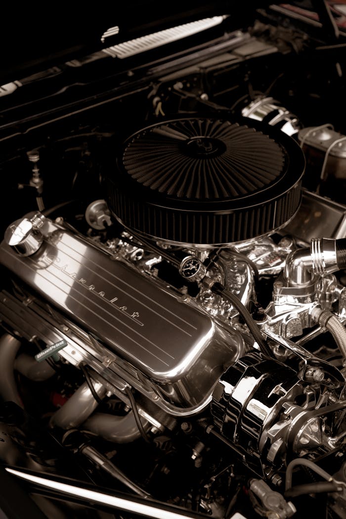 Detailed view of a shiny chrome car engine, showcasing power and precision.